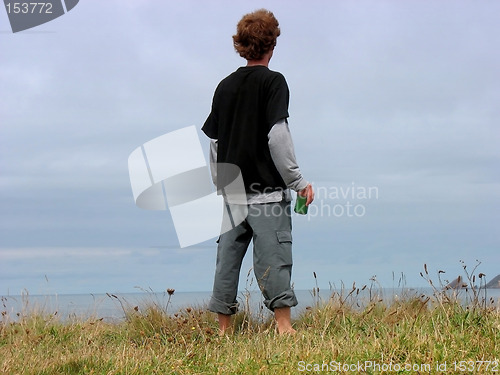 Image of a boy on a cliff