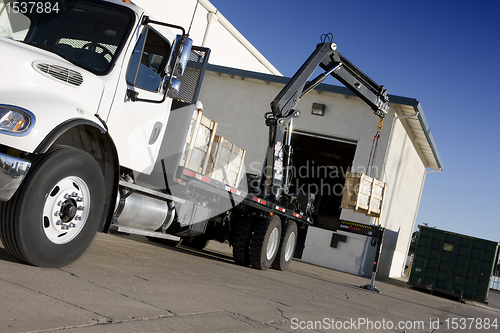 Image of crane delivering box