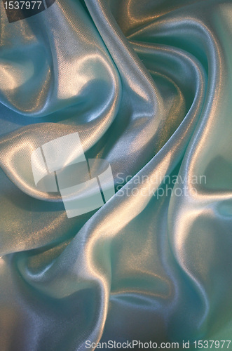 Image of Smooth elegant blue silk as background