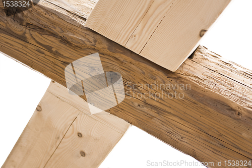 Image of wooden cross in old roof