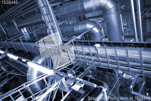 Image of Industrial zone, Steel pipelines and cables in blue tones  