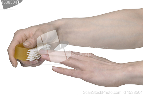 Image of cleaning nails with a scrubber