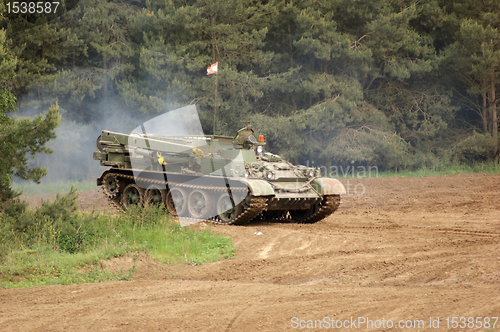 Image of outdoor scenery with driving tank