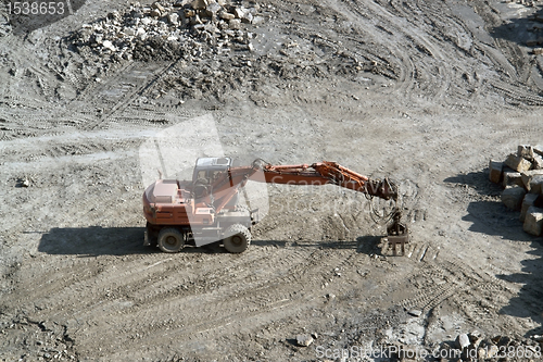 Image of resting red quarry digger