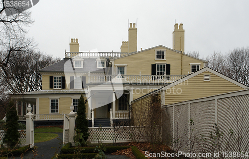 Image of Longfellow House in cloudy back