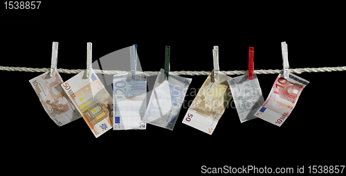 Image of clothesline and money