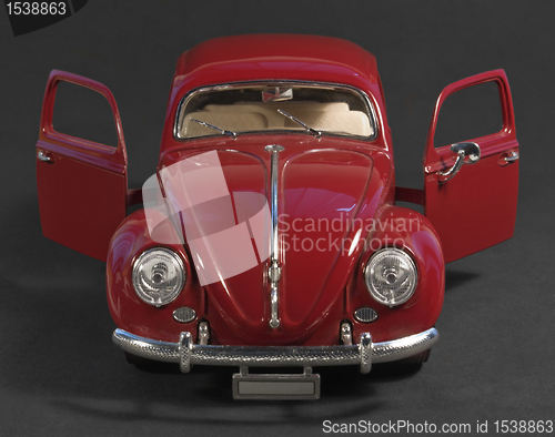 Image of red model car front with open doors