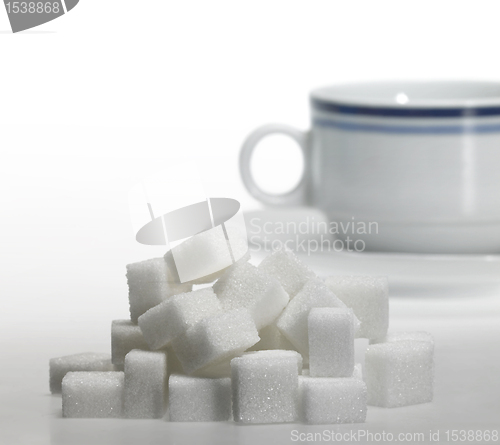 Image of lump sugar and porcelain coffee cup