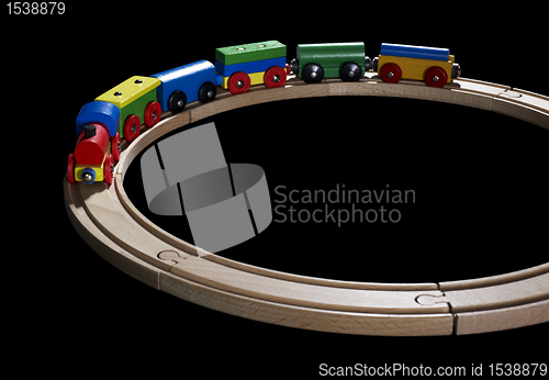 Image of wooden toy train on tracks