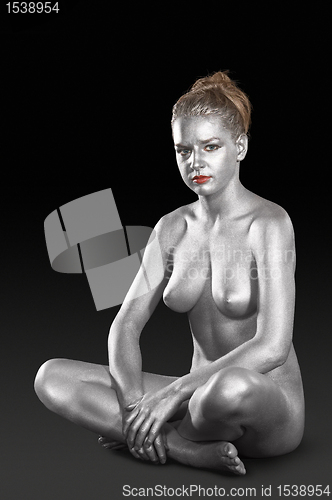 Image of silver bodypainted young woman