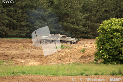 Image of offroad scenery with driving tank