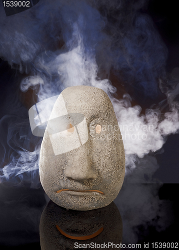 Image of illuminated sad ceramic head