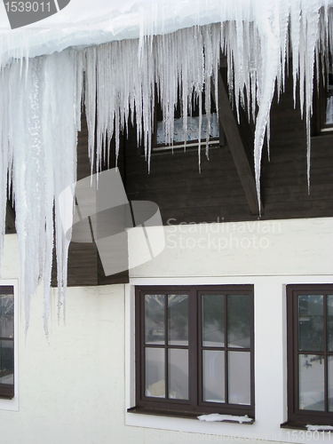 Image of icicles in front of a house facade