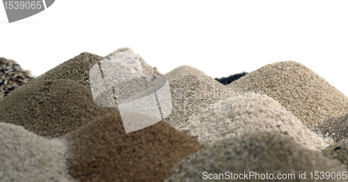 Image of various brown toned sand piles together