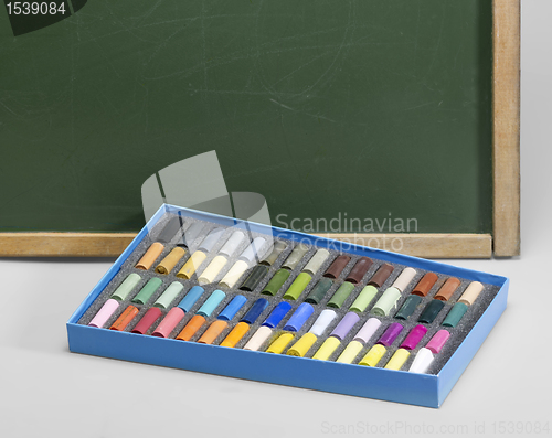 Image of blackboard edge and crayons