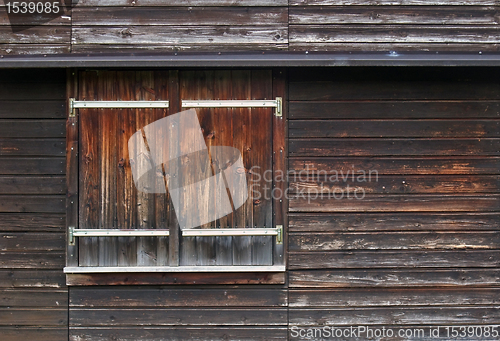 Image of wooden facade with shutter