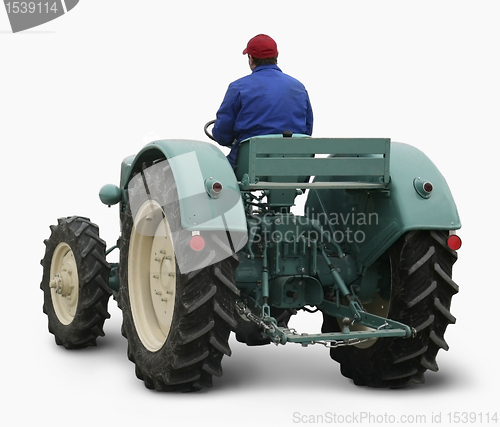 Image of man driving a tractor