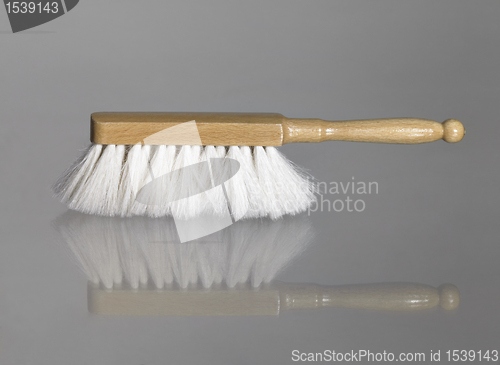 Image of small besom on glass surface