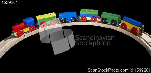 Image of wooden toy train on tracks