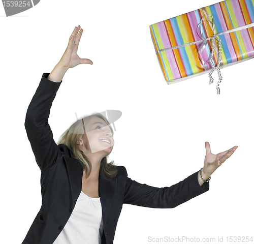 Image of blond girl is throwing a present