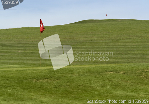 Image of golf course and flag