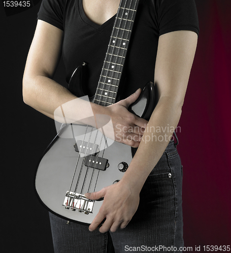 Image of woman with bass guitar