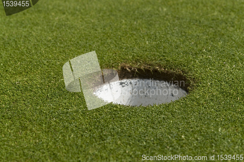 Image of golf hole closeup