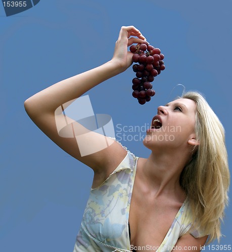 Image of Girl eating Grapes