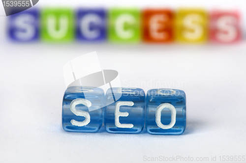 Image of Text SEO and success on colorful cubes