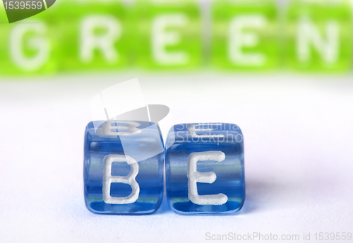 Image of Text Be green on colorful cubes