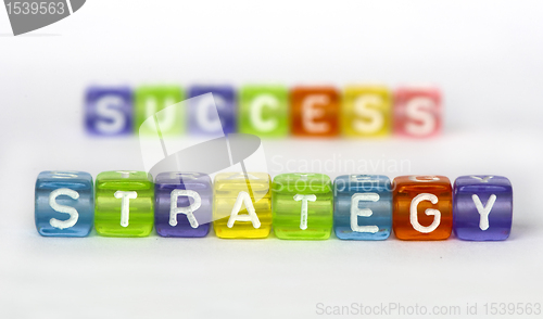 Image of Text Strategy and success on colorful cubes