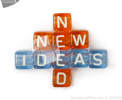 Image of Texts Ideas, New and Need on colorful cubes