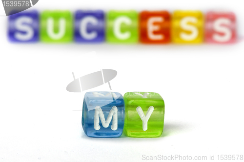 Image of Text My success on colorful wooden cubes