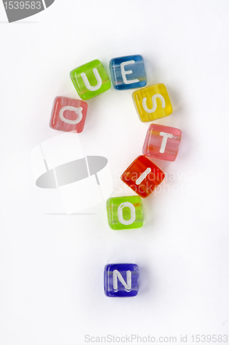 Image of Text nd sign question on colorful cubes 