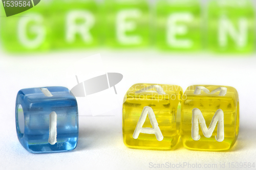 Image of Text I am green on colorful cubes