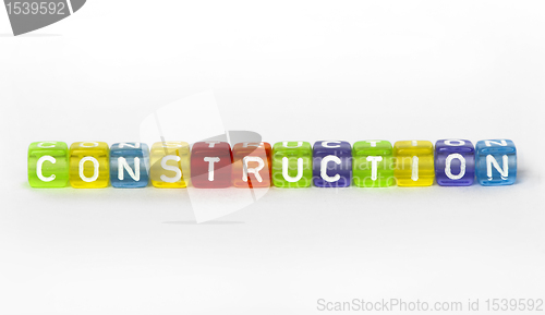 Image of Text construction on colorful wooden cubes