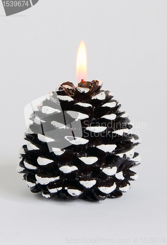 Image of Burning decorative candle. 