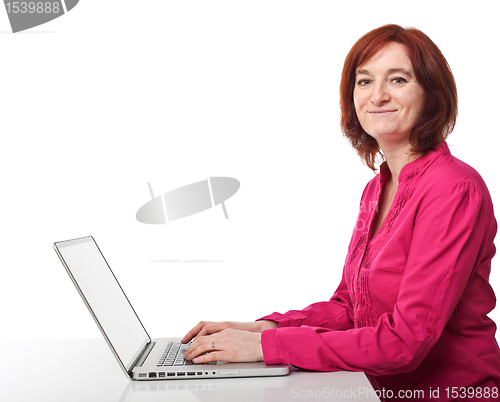 Image of smiling woman with pc