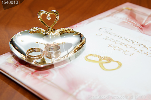 Image of wedding rings and marriage certificate