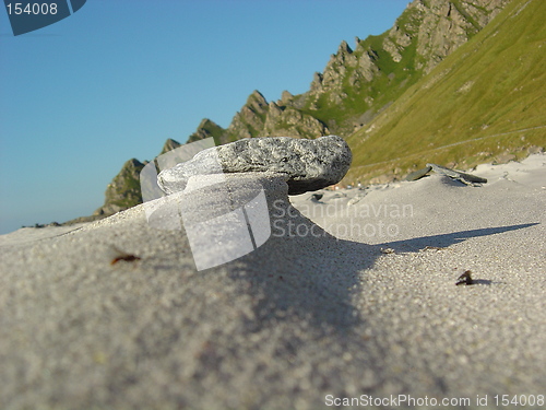 Image of stone on windswept beach