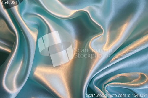 Image of Smooth elegant blue silk as background