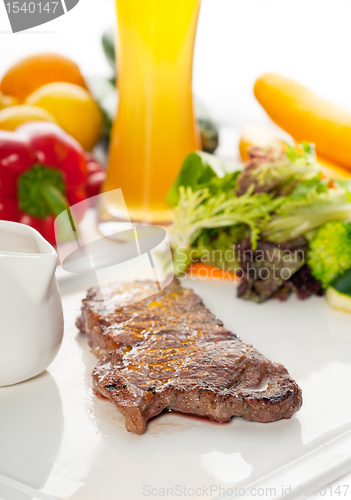 Image of juicy BBQ grilled rib eye ,ribeye steak and vegetables