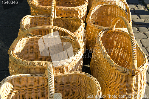 Image of Wicker hand made baskets selling in outdoor fair 