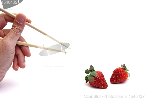 Image of chopsticks and strawberry