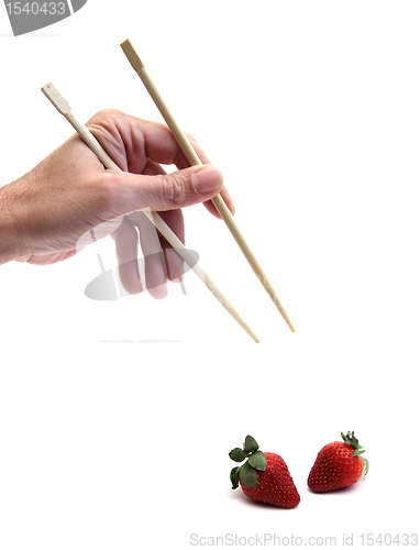 Image of chopsticks and strawberries