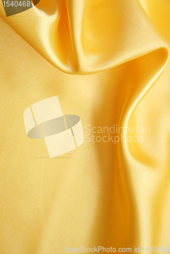 Image of Smooth elegant golden silk as background 