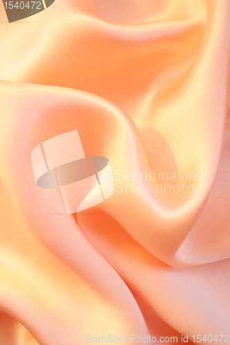 Image of Smooth elegant golden pink silk as background