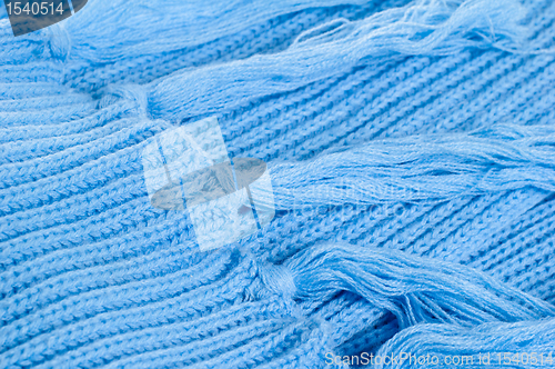 Image of Blue knitted scarf, close up