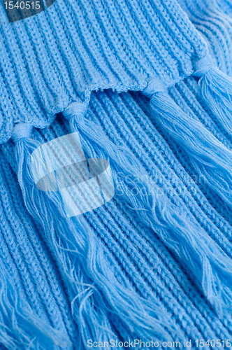 Image of Blue knitted scarf, close up