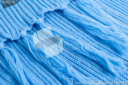 Image of Blue knitted scarf, close up